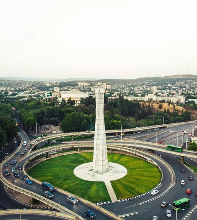 Framed Print : Tbilisi, Georgia - 15th july, 2022: aerial view automobiles in traffic on roundabout in Tbilisi center Framed Print : Tbilisi, Georgia - 15th july, 2022: aerial view automobiles in traffic on roundabout in Tbilisi center
