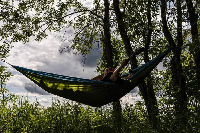 Framed Print : Teen Boy Plays Guitar While Relaxing in Hammock Outdoors Framed Print : Teen Boy Plays Guitar While Relaxing in Hammock Outdoors