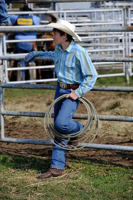 Framed Print : Teen cowboy holding rope Framed Print : Teen cowboy holding rope