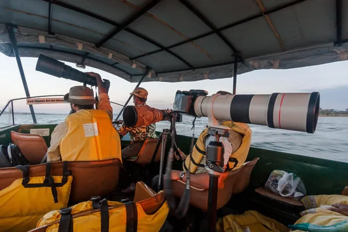 Framed Print : The Telephoto lenses of Wildlife Photographers during the boat ride safari inside Kabini Nagarhole Tiger Reserve Framed Print : The Telephoto lenses of Wildlife Photographers during the boat ride safari inside Kabini Nagarhole Tiger Reserve