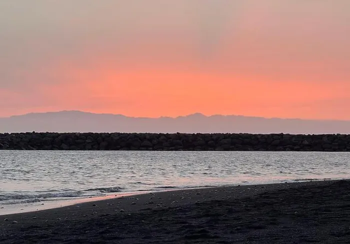Framed Print : A Tenerife beach with black volcanic sand at sunset Framed Print : A Tenerife beach with black volcanic sand at sunset