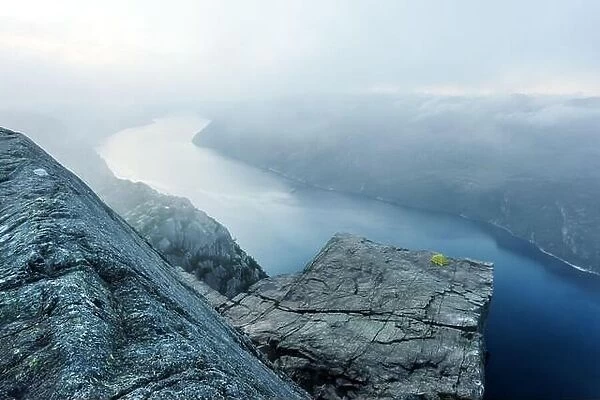 Alone tent near Trolltunga rock - most spectacular and famous scenic cliff in Norway