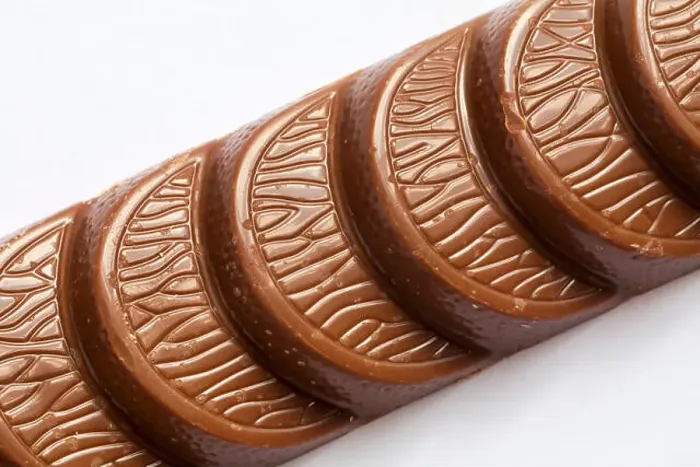 Framed Print : Terry's chocolate orange milk chocolate bar made with real orange oil unwrapped close up set on white background Framed Print : Terry's chocolate orange milk chocolate bar made with real orange oil unwrapped close up set on white background