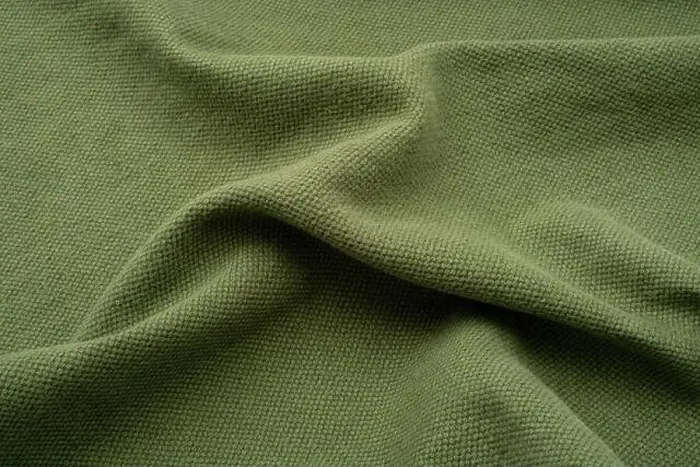 Framed Print : Textured fabric background. An olive green coloured ruched up linen Framed Print : Textured fabric background. An olive green coloured ruched up linen
