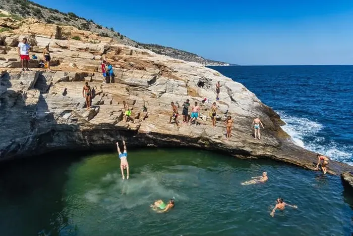 Framed Print : Thassos, Greece - July 20, 2019: Tourists are doing diving in the natural swimming pool Giola in Thassos island, Greece Framed Print : Thassos, Greece - July 20, 2019: Tourists are doing diving in the natural swimming pool Giola in Thassos island, Greece