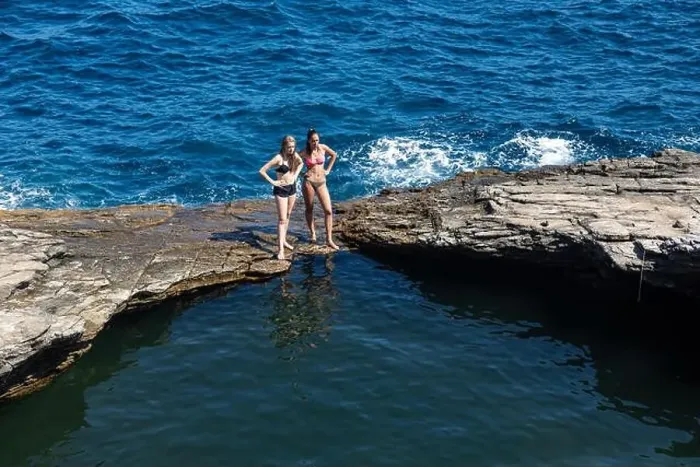 Framed Print : Thassos, Greece - July 20, 2019: Tourists are doing diving in the natural swimming pool Giola in Thassos island, Greece Framed Print : Thassos, Greece - July 20, 2019: Tourists are doing diving in the natural swimming pool Giola in Thassos island, Greece