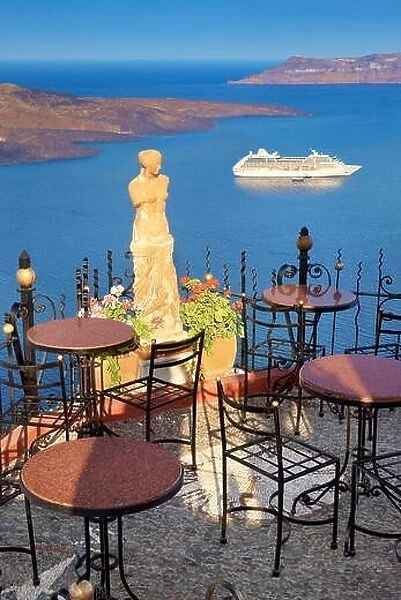Thira (capital city of Santorini) - cafe with a background view to sae and cruise ship, Santorini Island, Greece