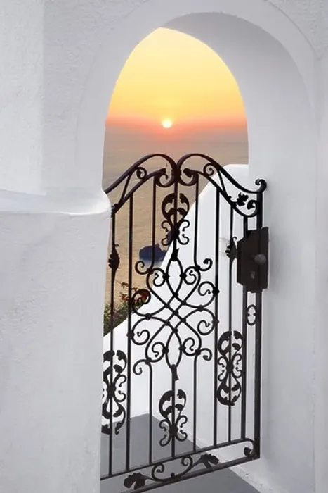 Framed Print : Thira (capital city of Santorini) - doorway with white walls and the sunset in the background, Santorini Island, Greece Framed Print : Thira (capital city of Santorini) - doorway with white walls and the sunset in the background, Santorini Island, Greece