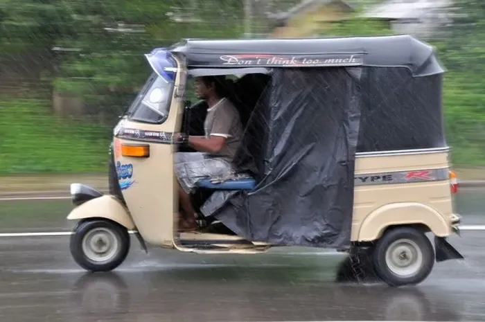Framed Print : Three-wheeler in heavy rain, Sri Lanka Framed Print : Three-wheeler in heavy rain, Sri Lanka