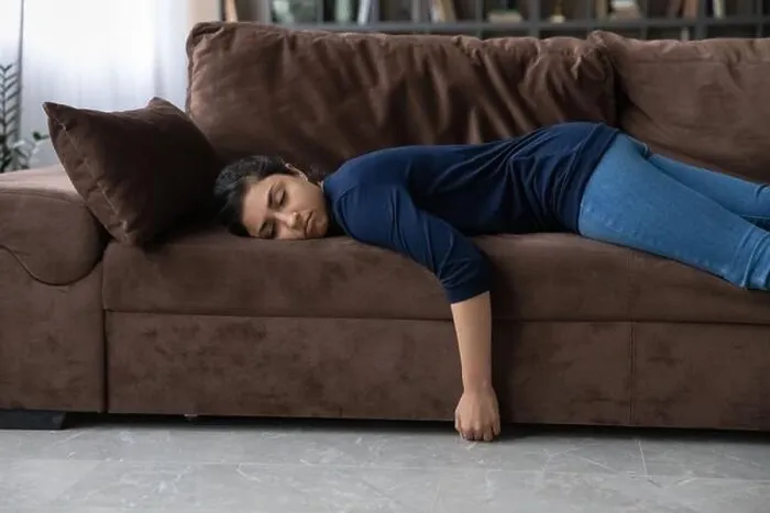 Framed Print : Tired Indian woman sleep on couch at home Framed Print : Tired Indian woman sleep on couch at home