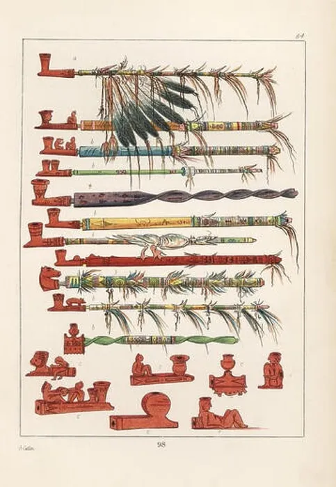 Framed Print : Tobacco pipes of the Native Americans, and a peace pipe with war-eagle feathers at top. The pipes are carved from pipe-stone, red steatite Framed Print : Tobacco pipes of the Native Americans, and a peace pipe with war-eagle feathers at top. The pipes are carved from pipe-stone, red steatite