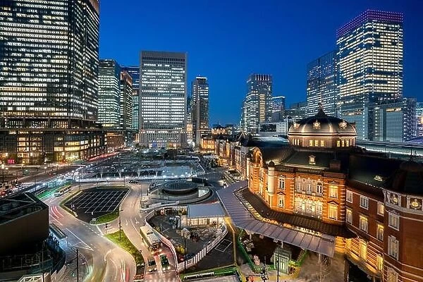 Tokyo railway station and Tokyo highrise building at twilight time in Tokyo, Japan