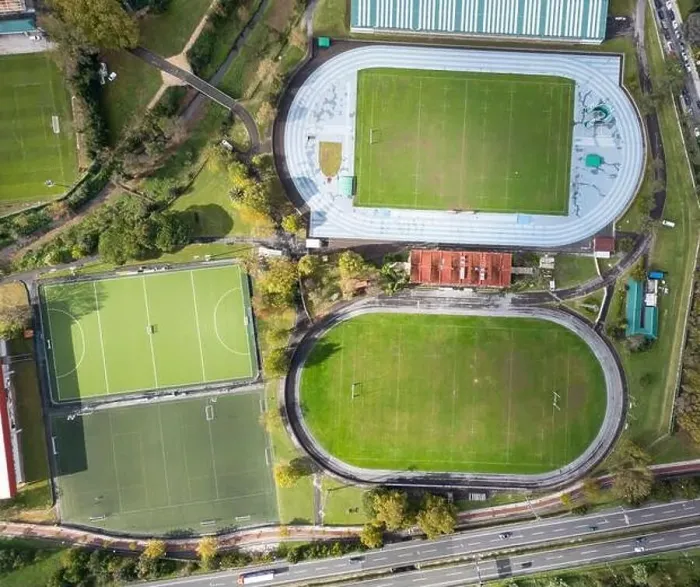 Framed Print : A top-down drone photograph showcasing various sports fields including a running track Framed Print : A top-down drone photograph showcasing various sports fields including a running track