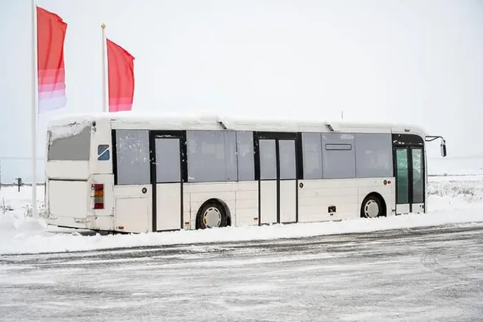 Framed Print : Tourist bus drove through snow capped streets with winter scenery in Iceland Framed Print : Tourist bus drove through snow capped streets with winter scenery in Iceland