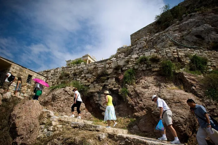 Framed Print : Tourists climb the path up to the Acropolis in Athens