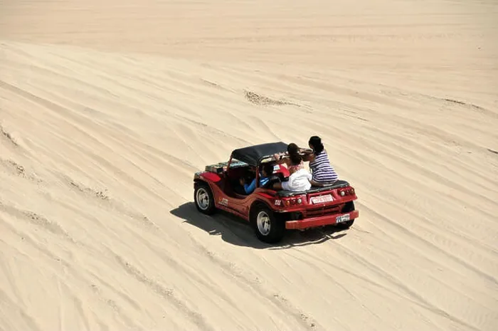 Framed Print : Tourists walking in the dunes buggy Genipabu - Polo Dunes Coast Framed Print : Tourists walking in the dunes buggy Genipabu - Polo Dunes Coast