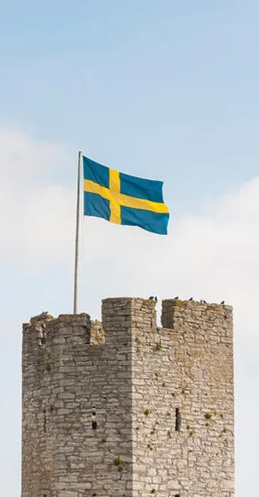 Framed Print : Tower of the Visby city wall and the Swedish flag, Gotland, Sweden. Scandinavia Framed Print : Tower of the Visby city wall and the Swedish flag, Gotland, Sweden. Scandinavia