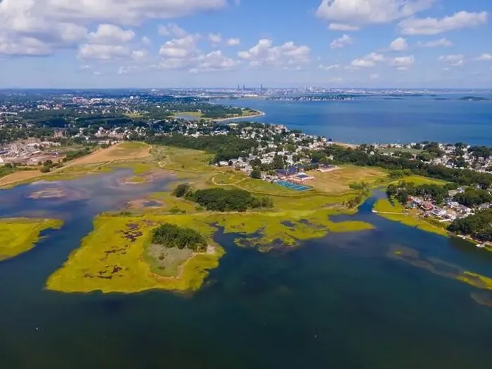 Framed Print : Town River Bay aerial view next to Quincy Bay with Boston modern skyline at the background in city of Quincy Framed Print : Town River Bay aerial view next to Quincy Bay with Boston modern skyline at the background in city of Quincy