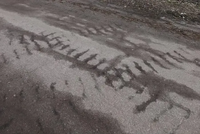 Framed Print : Traces of military vehicles on the asphalt, war in Ukraine