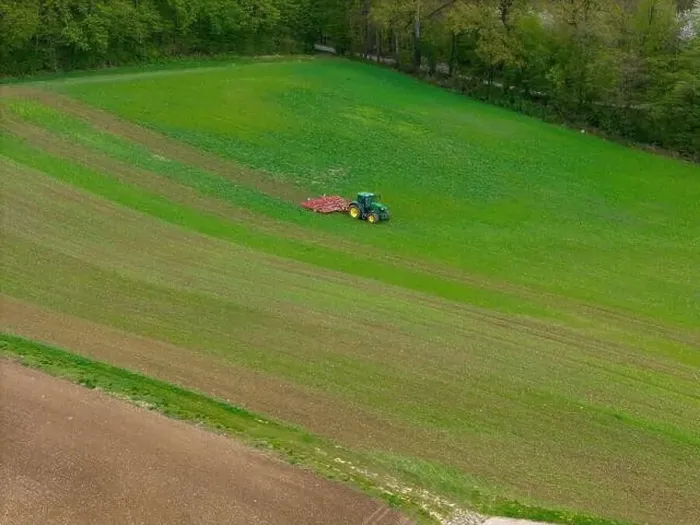 Framed Print : Tractor with cultivator in a field with small plants captured with a drone Framed Print : Tractor with cultivator in a field with small plants captured with a drone