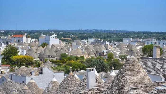 Framed Print : The traditional Trulli houses from the beautiful town Alberobello, Apulia, Italy Framed Print : The traditional Trulli houses from the beautiful town Alberobello, Apulia, Italy