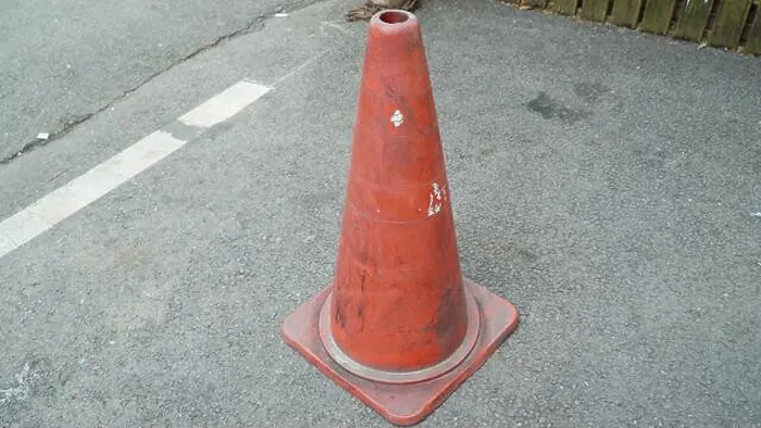 Framed Print : Traffic Cone with White Horizontal Stripe Paint Erased on the Asphalt Side Walk Framed Print : Traffic Cone with White Horizontal Stripe Paint Erased on the Asphalt Side Walk