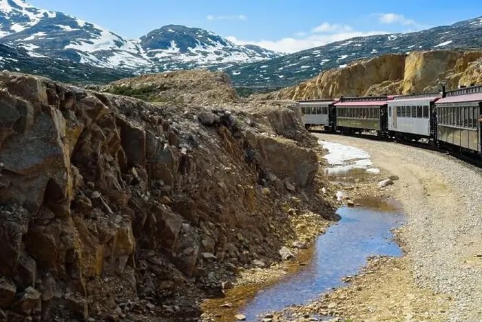 Framed Print : A train on the White Pass and Yukon Route railroad out of Skagway, Alaska, rounds the loop at the top of the pass Framed Print : A train on the White Pass and Yukon Route railroad out of Skagway, Alaska, rounds the loop at the top of the pass