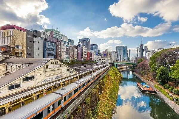 Trains pass by the Kanda River in the Ochanomizu district of Tokyo, Japan