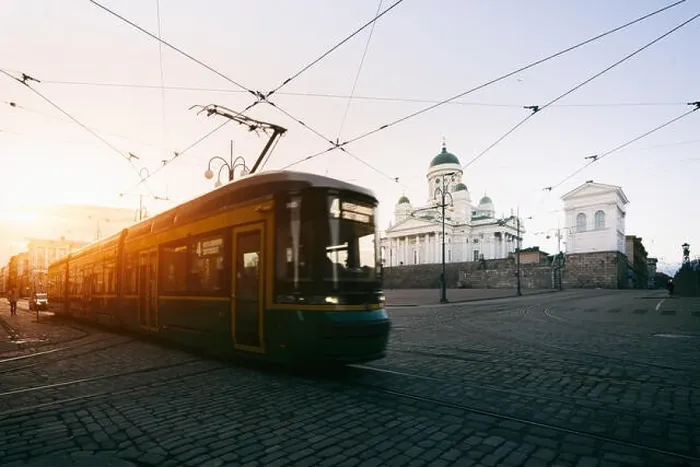 Framed Print : Tram passing Helsinki Senate Square during sunset with Helsinki Cathedral in the background at Finland