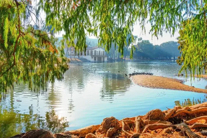 Framed Print : Tranquil scene featuring a peaceful lake surrounded by lush greenery Framed Print : Tranquil scene featuring a peaceful lake surrounded by lush greenery