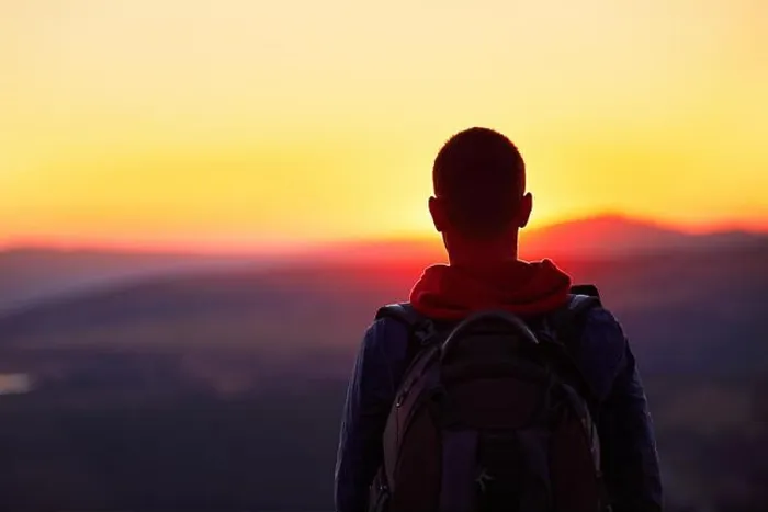 Framed Print : Traveler with backpack watching amazing sunset Framed Print : Traveler with backpack watching amazing sunset
