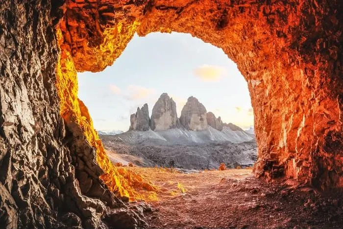 Framed Print : Tre Cime Di Lavaredo peaks in incredible orange sunset light. View from the cave in mountain against Three peaks of Lavaredo, Dolomite Alps, Italy Framed Print : Tre Cime Di Lavaredo peaks in incredible orange sunset light. View from the cave in mountain against Three peaks of Lavaredo, Dolomite Alps, Italy