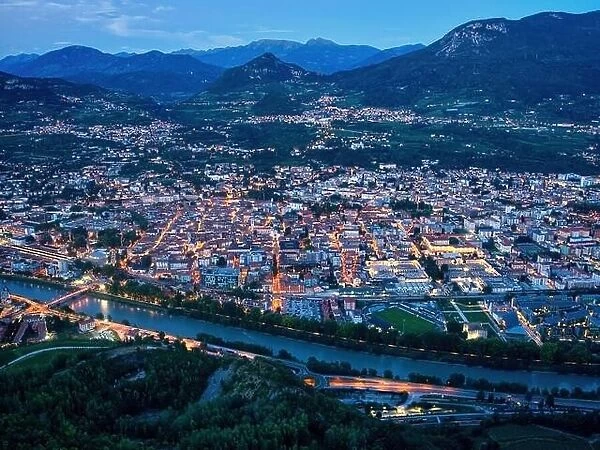 Trento city aerial panoramic view. Night city lights view from above in Trento city in Trentino Alto Adige in Italy