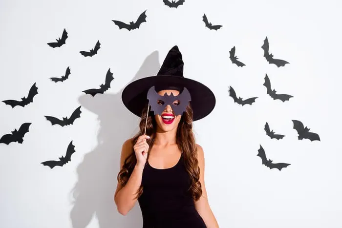 Framed Print : Trick or threat Close up portrait of cheerful woman with curly Framed Print : Trick or threat Close up portrait of cheerful woman with curly