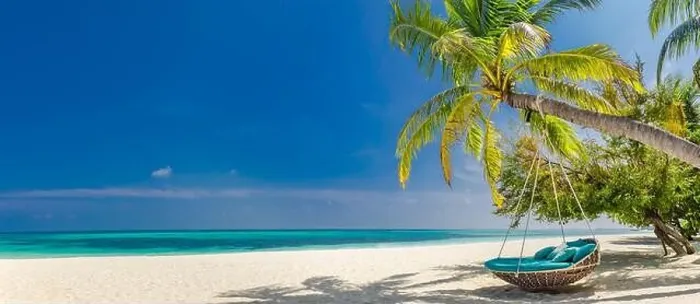 Framed Print : Tropical beach panorama as summer landscape with beach swing or hammock and white sand and calm sea for beach banner. Perfect beach scene vacation Framed Print : Tropical beach panorama as summer landscape with beach swing or hammock and white sand and calm sea for beach banner. Perfect beach scene vacation