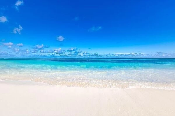 Empty tropical beach with soft waves splashing background. Horizon with sky and white sand. Idyllic beach landscape, island shoreline