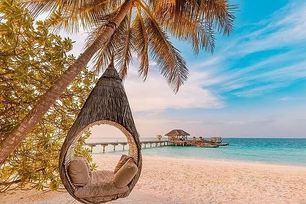 Tropical beach sunset as summer landscape with luxury resort beach palm swing hammock, sand seaside shore for sunset beach landscape. Tranquil beach