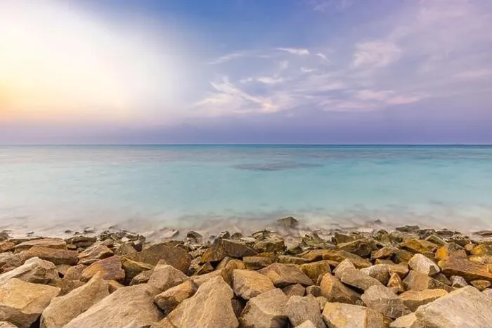 Framed Print : Tropical island view with beautiful sunset over the green boulders on a wave breaker. Rocks on exotic shore under colorful sky and horizon. Exotic sea Framed Print : Tropical island view with beautiful sunset over the green boulders on a wave breaker. Rocks on exotic shore under colorful sky and horizon. Exotic sea
