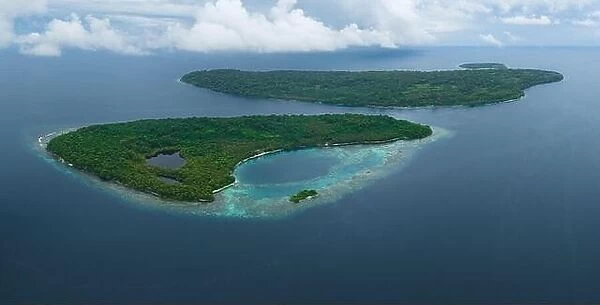 Tropical islands are fringed by coral reefs in the Solomon Islands. This beautiful South Pacific country is home to spectacular marine biodiversity