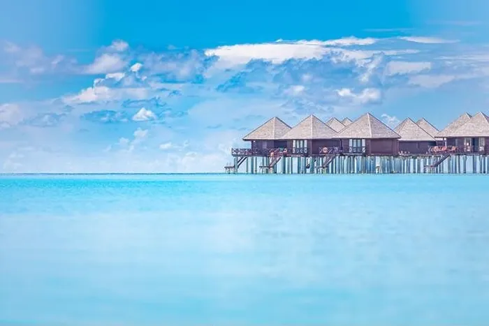 Framed Print : Tropical panorama, luxury water villa resort with wooden pier or jetty. Luxury travel destination background for summer holiday vacation in Maldives Framed Print : Tropical panorama, luxury water villa resort with wooden pier or jetty. Luxury travel destination background for summer holiday vacation in Maldives