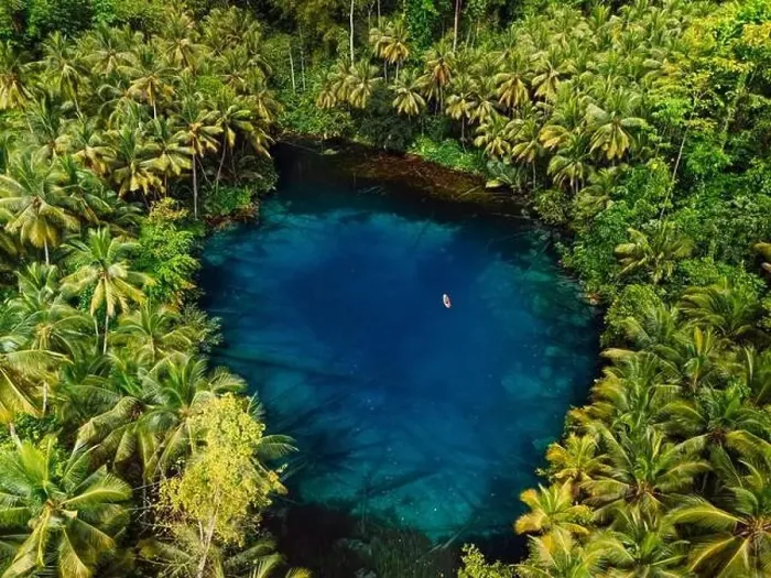 Framed Print : Tropical transparent lake with crystal blue fresh water in jungle forest on Sulawesi, Indonesia. Aerial view Framed Print : Tropical transparent lake with crystal blue fresh water in jungle forest on Sulawesi, Indonesia. Aerial view