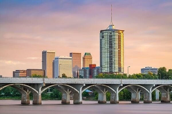Tulsa, Oklahoma, USA downtown skyline on the Arkansas River at dusk