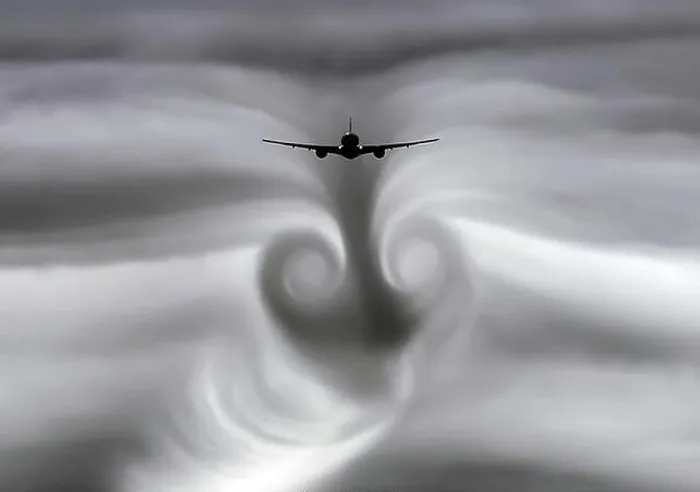 Framed Print : The turbulence of the clouds left by the plane during Framed Print : The turbulence of the clouds left by the plane during