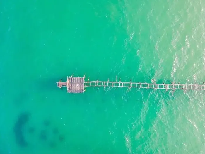 Framed Print : Turquoise water and concrete jetty pier, drone shot Framed Print : Turquoise water and concrete jetty pier, drone shot