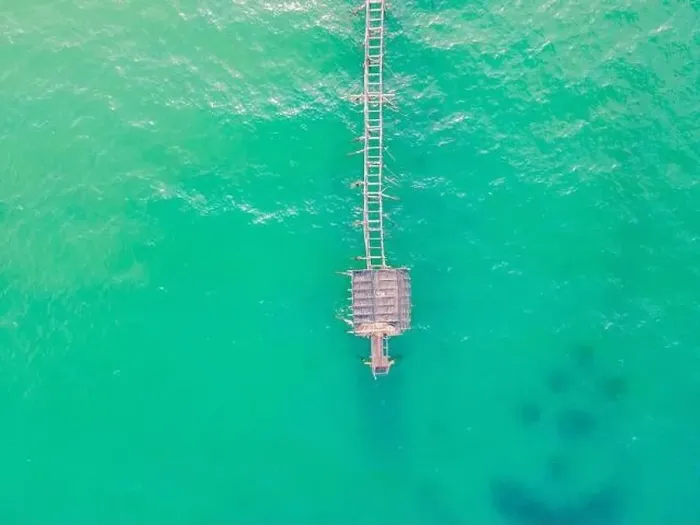 Framed Print : Turquoise water and concrete jetty pier, drone shot Framed Print : Turquoise water and concrete jetty pier, drone shot