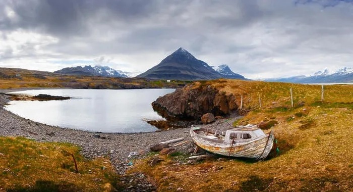 Framed Print : Typical Iceland landscape with fjord, mountains and old ship Framed Print : Typical Iceland landscape with fjord, mountains and old ship