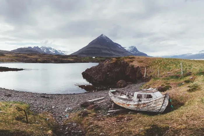 Framed Print : Typical Iceland landscape with fjord, mountains and old ship Framed Print : Typical Iceland landscape with fjord, mountains and old ship