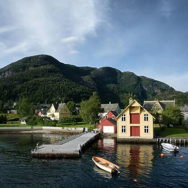 Typical norwegian landscape with red house