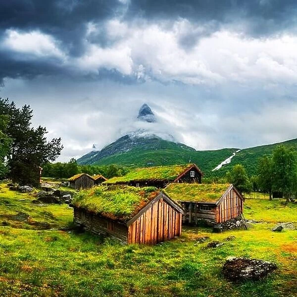Typical norwegian old wooden houses with grass roofs in Innerdalen - Norway's most beautiful mountain valley, near Innerdalsvatna lake