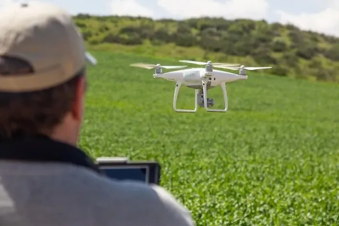 Framed Print : UAV Drone Pilot Flying and Gathering Data Over Country Farm Land Framed Print : UAV Drone Pilot Flying and Gathering Data Over Country Farm Land